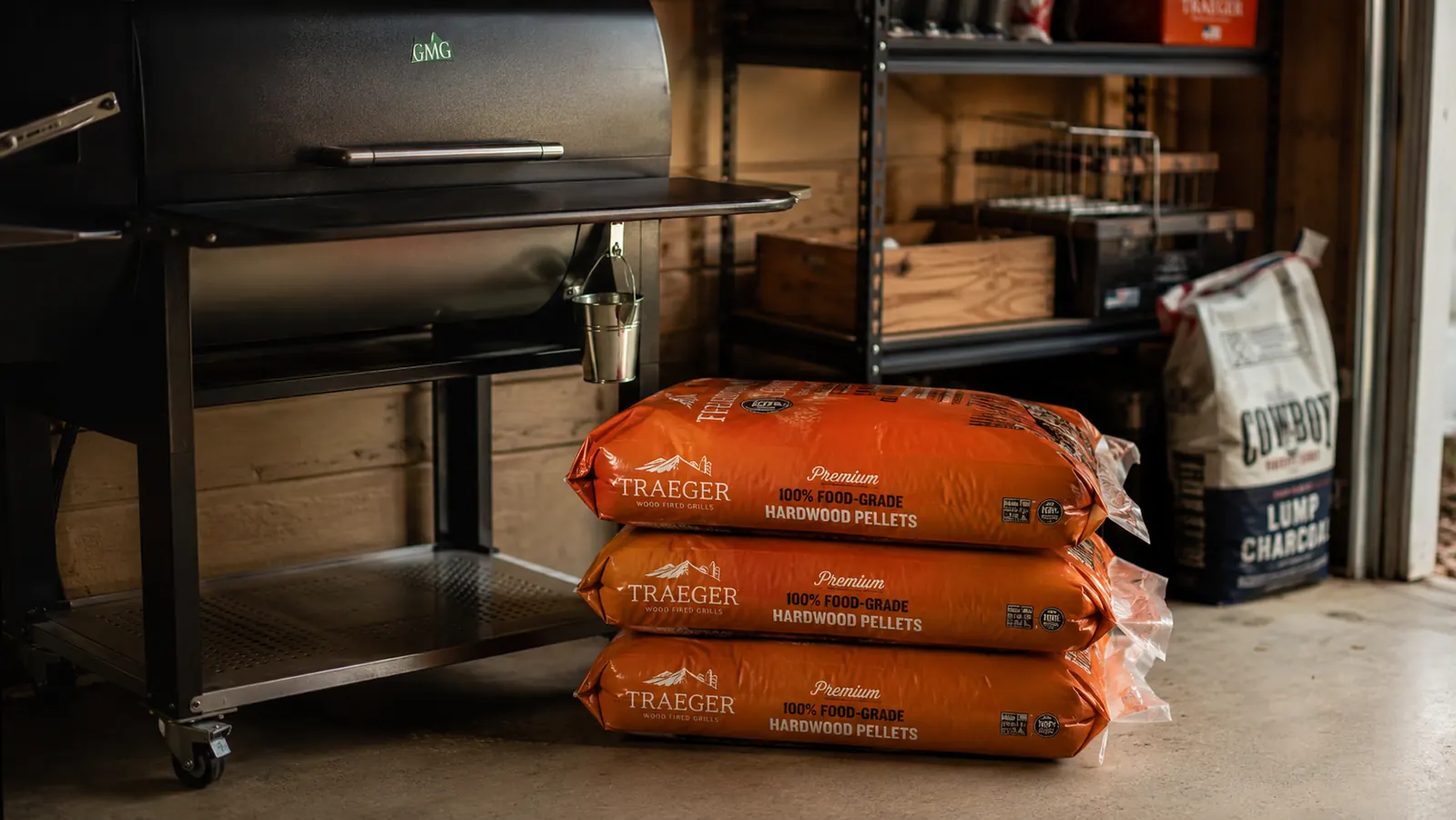 Bag of Traeger Signature Blend wood pellets leaning against a pellet grill on a backyard patio, late afternoon light